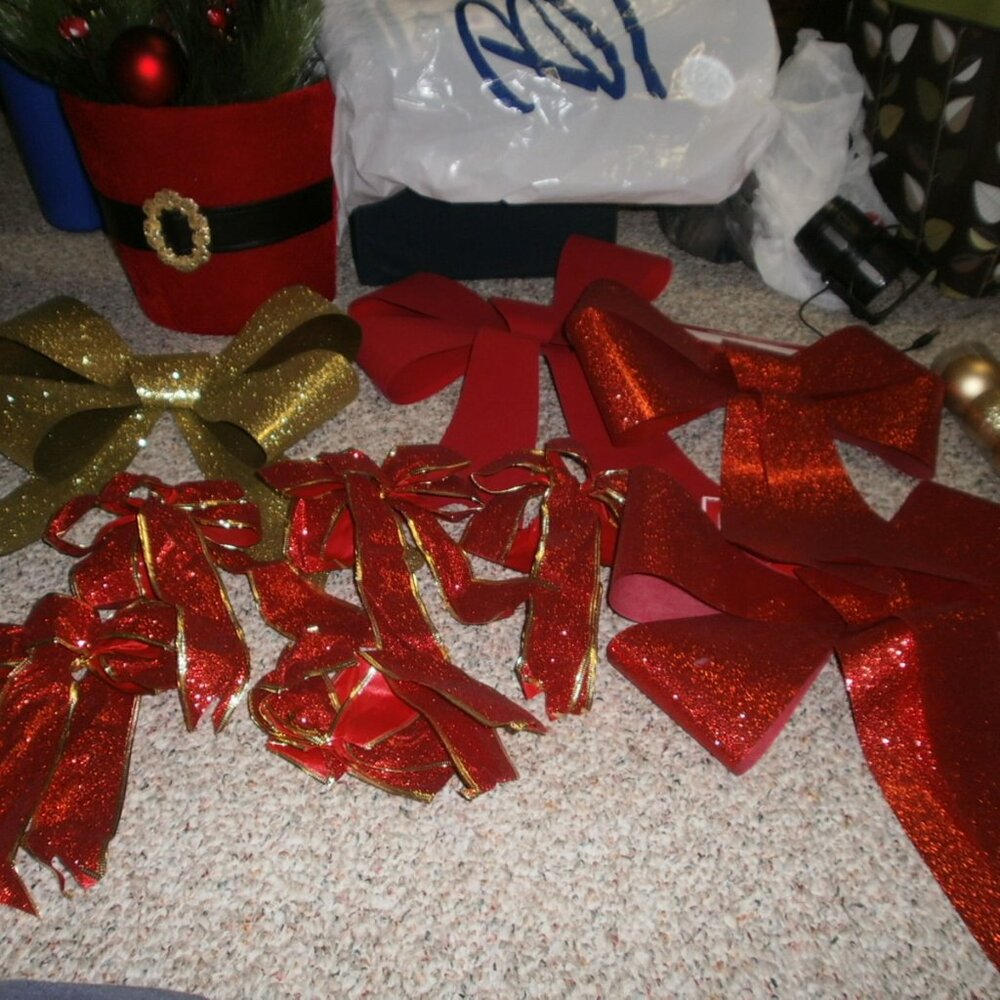 Bows red, green, and velvet Santa belt floral arrangement